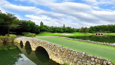 RG CityGolf Hole # 12 makes a picture postcard setting come to life. Two stone walled bridge with semi- circled culverts mirroring each other with lush green surroundings makes it a landscape to cherish