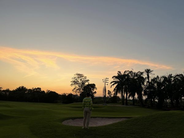 Summit Windmill Golf Club nbsp 1 person golfing golf cart twilight and golf course