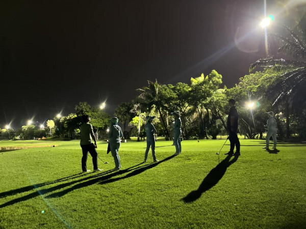 Summit Windmill Golf Club nbsp 6 people people golfing lighting golf course and grass