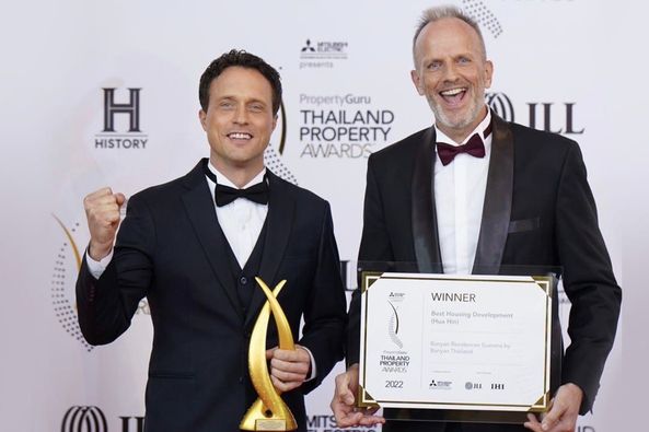 2 people people standing and H HISTORY PropertyGuru PropertyG THAILAND PROPERTY AWARDS ILL WINNER Housing Development Hin 2022 JLL