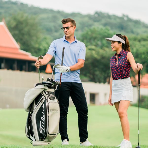 Banyan Golf Club Hua Hin 2 people and people golfing