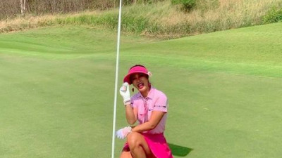                        ,   she had no idea her golf was about to get as hot as the summer temperatures. Selecting her 5 wood for the shot at hand, she then proceeded to hit the perfect shot and a few minutes later would be picking her ball out of the hole