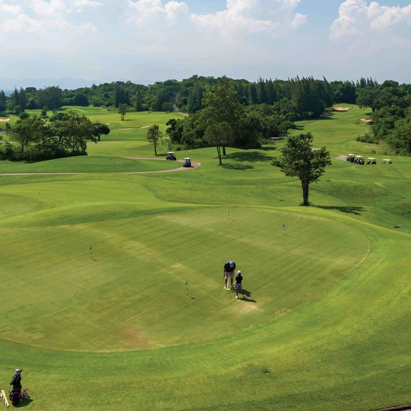 Banyan Golf Club Hua Hin 3 people people golfing golf cart and golf course