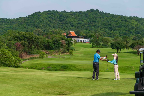 Banyan Golf Club Hua Hin 2 people people golfing golf cart and golf course