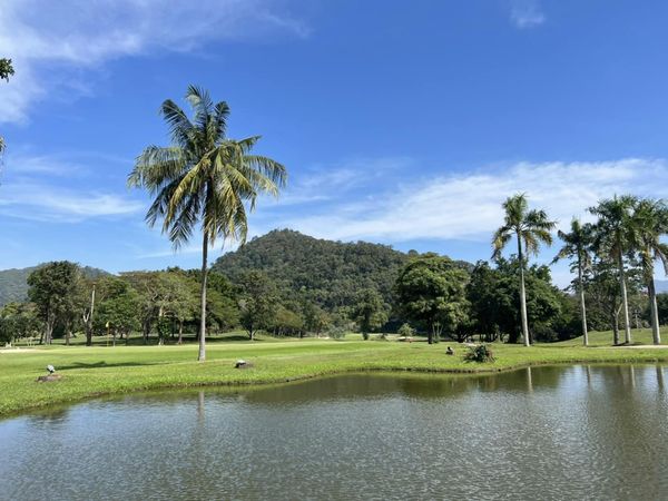 Bangpra Golf Club and Resort sky grass nature body of water and tree