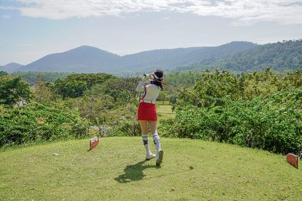 Wangjuntr Golf Park 1 person standing and grass