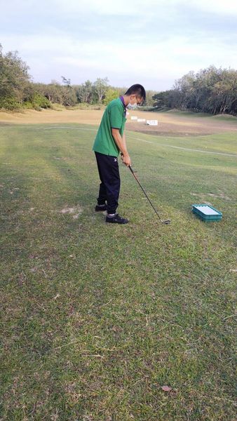 Wangjuntr Golf Park 1 person and grass