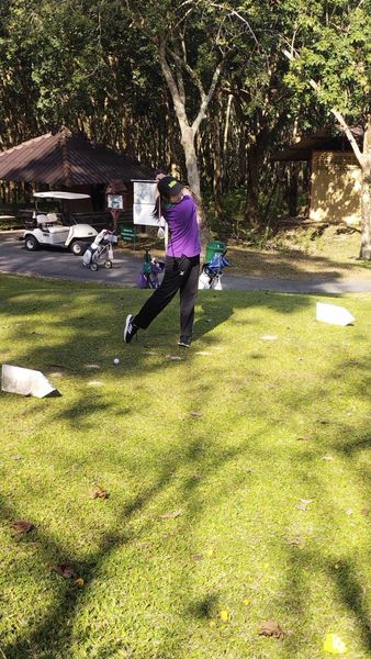 Wangjuntr Golf Park 3 people and grass