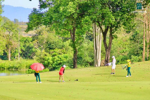 Laem Chabang International Country Club 4 people people playing sports people standing grass and nature