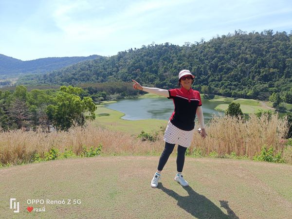 Wangjuntr Golf Park 1 person standing and grass