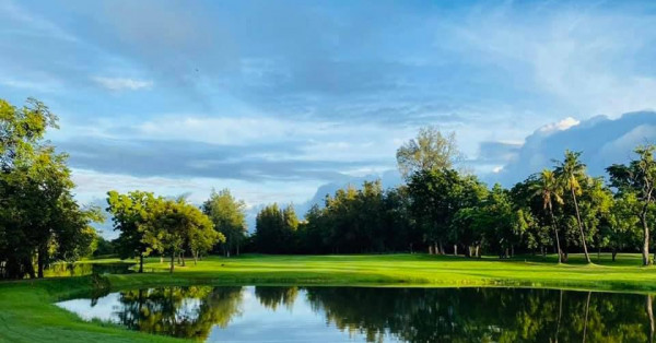 Bangpra Golf Club and Resort golf course lake grass tree and twilight