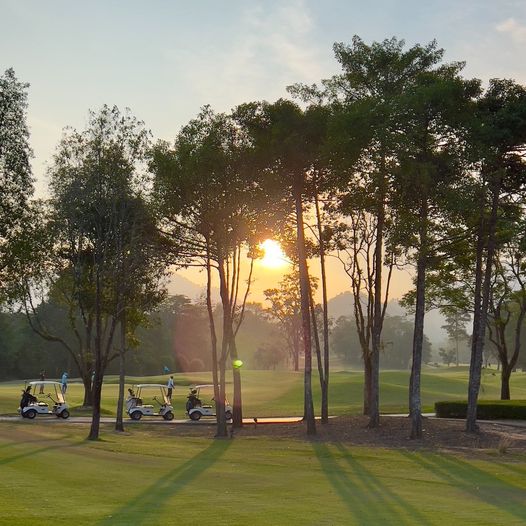 Chatrium Golf Resort Soi Dao Chanthaburi 2 people people golfing golf cart twilight and golf course