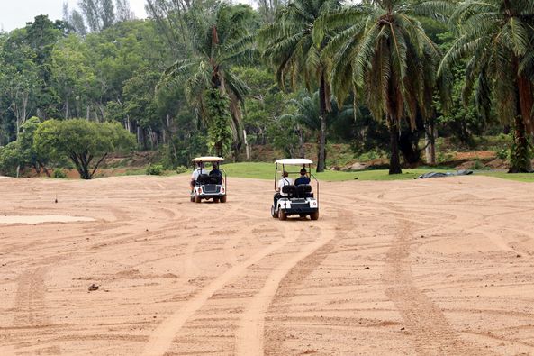 Blue Canyon Country Club 1 person golfing golf cart grass and golf course