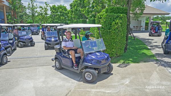 Aquella Golf amp Country Club 2 people people golfing golf cart and text