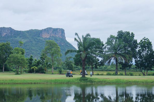 Mida Golf Club Kanchanaburi 2 people people golfing golf course and mountain